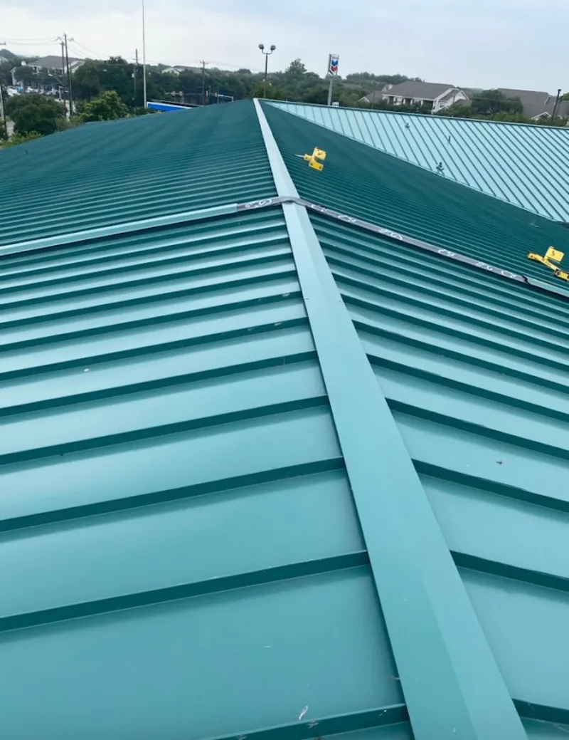 Green commercial metal roof ridge and valley for Metal Roof Repair in Northwood