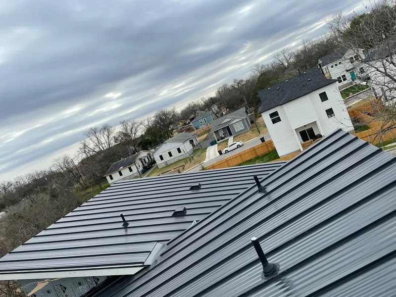 Standing seam metal roof panels with vents for Skylight Repair in Northwood
